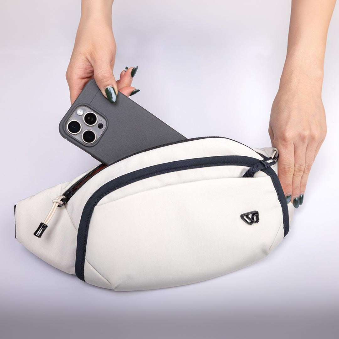 Person showcasing The Belt Bag's storage capabilities