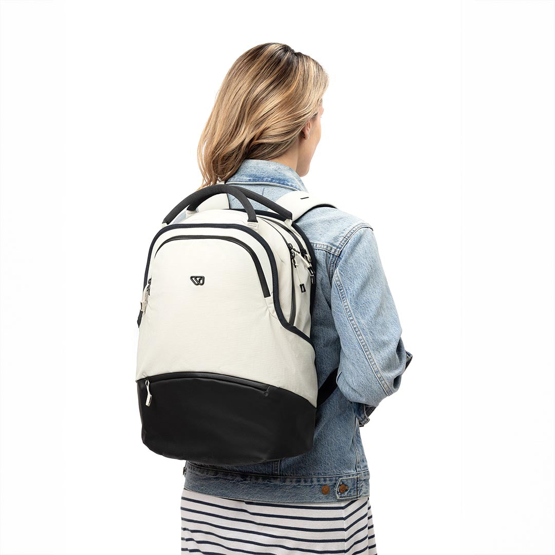 Person carrying The Daily Pack in white