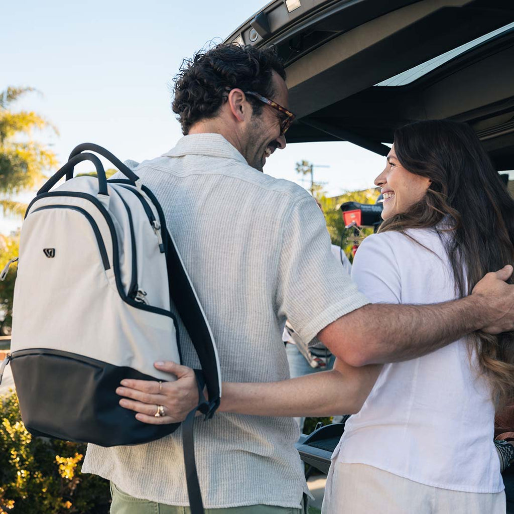 Parents preparing for a trip with a high-quality travel backpack: The Daily Pack
