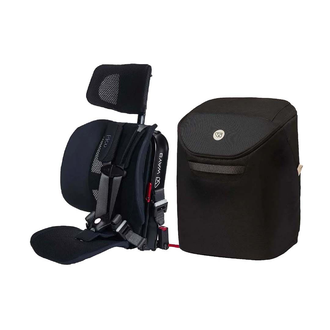 A black car seat travel system accessory set on a white background, featuring a child car seat with an attached headrest and harness next to a matching soft storage bag.